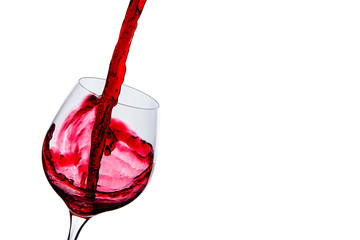 wine is poured into a glass on a white background