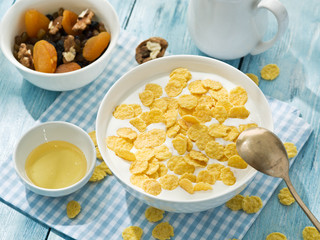 Cornflakes cereal and milk.