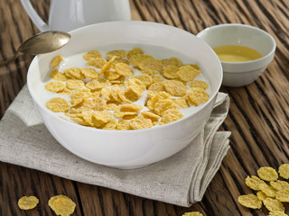 Cornflakes cereal and milk.