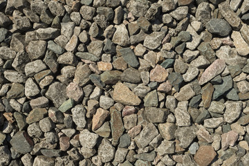 Hintergrund verdichteter Schotter als Straßenbelag