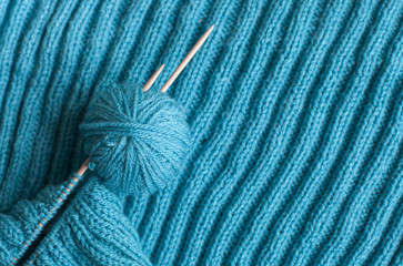 ball and spokes on a knitted background