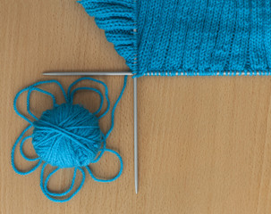 ball and spokes on a knitted background