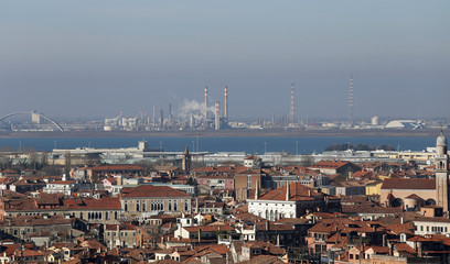 smokestacks and factories polluting with smoke near Venice