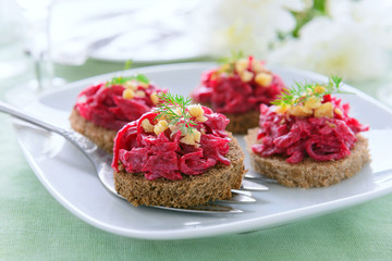 Canape with beetroot pesto on festive table