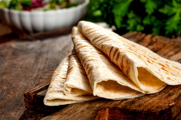 Close-up image of a empty tortilla on the wooden table
