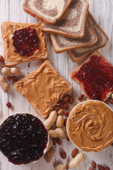 Sweet sandwiches with jam and peanut butter top view
