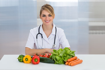 Female Dietician With Vegetables