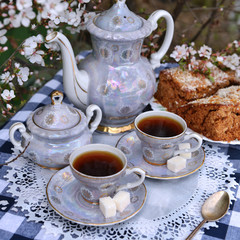 Still life with old tea set and home cake 