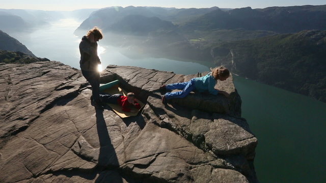 Family on Preikestolen massive cliff top (Norway)

