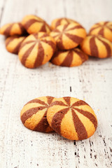 Delicious cookies on white wooden background