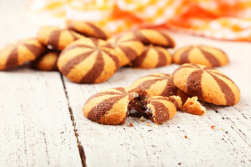 Delicious cookies on white wooden background