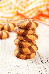 Delicious cookies on white wooden background