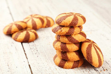 Delicious cookies on white wooden background