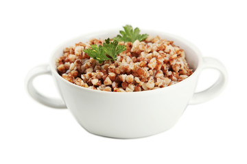 Buckwheat in a bowl isolated on white