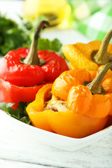 Red and yellow peppers stuffed with meat, rice and vegetables