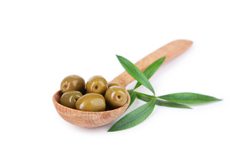 Green olives in spoon isolated on white
