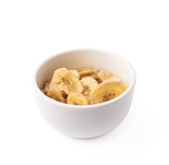 Bowl filled with banana slices isolated