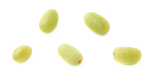 Five single white grapes isolated