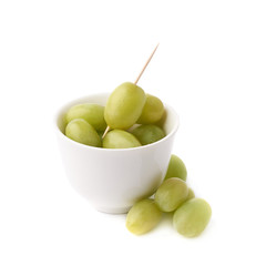 White grapes in a ceramic bowl isolated