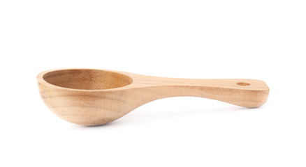 Small wooden measure spoon isolated
