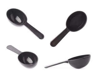 Black plastic measure spoon isolated