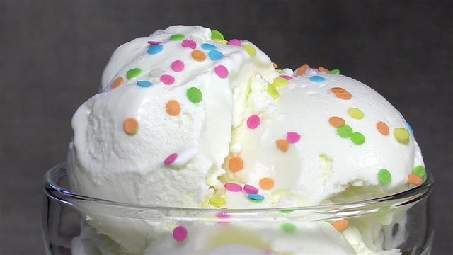 Vanilla ice cream decorated with confectionery sprinkles