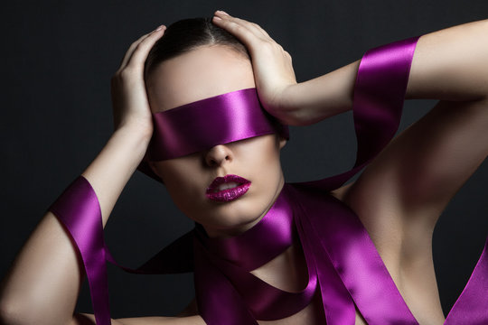 portrait of a girl with a ribbon in her eyes