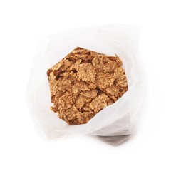 Plastic bag of cereal flakes isolated