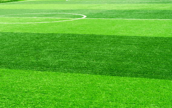 white stripe on artificial green grass of soccer field
