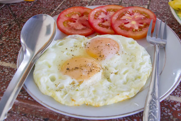 Double fried egg with tomato, Vietnamese breakfast style