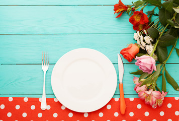 Dinner accessories on blue wooden table. Top view