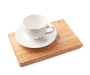 Empty cup on a wooden board isolated