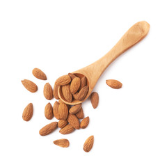 Spoon full of almond seeds isolated