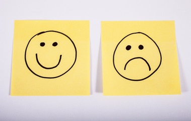 Happy and Sad Faces on Memo Paper