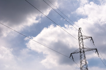 High-voltage pole on the sky background