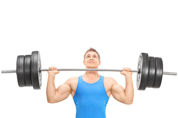 Male weightlifting athlete lifting a heavy weight