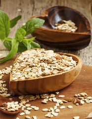Homemade muesli in a bowl in the shape of a heart on a wooden ta