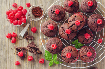 Brown muffins with raspberries and chocolate fresh baked