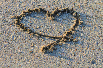  heart shape drawn in the sand