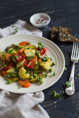 roasted vegetables in a light vintage plate 