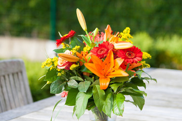 Colorful bouquet of flowers on the garden table