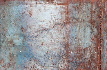 scratched and rusty orange metal surface