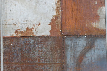 scratched and rusty orange metal surface