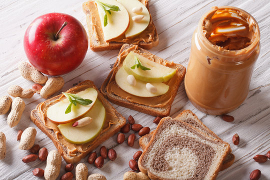 Sandwiches With An Apple And Peanut Butter Horizontal Top View
