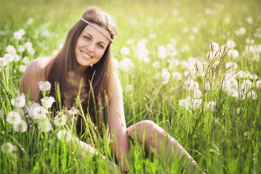 Young woman smiling in a meadow