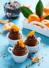 Chocolate cupcakes with orange and chocolate.
