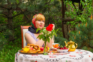 Beautiful Russian girl with a curvaceous, rosy and happy sitting