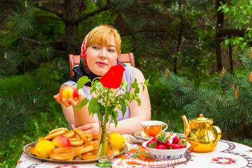 Beautiful Russian girl with a curvaceous, rosy and happy sitting