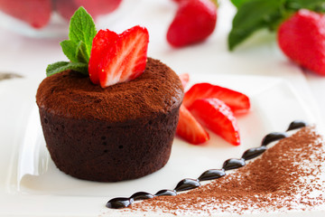 chocolate pudding with fudge center with strawberries,