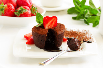 chocolate pudding with fudge center with strawberries,